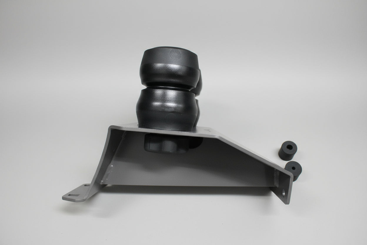 Metal bracket with spherical component on a gray tiled floor