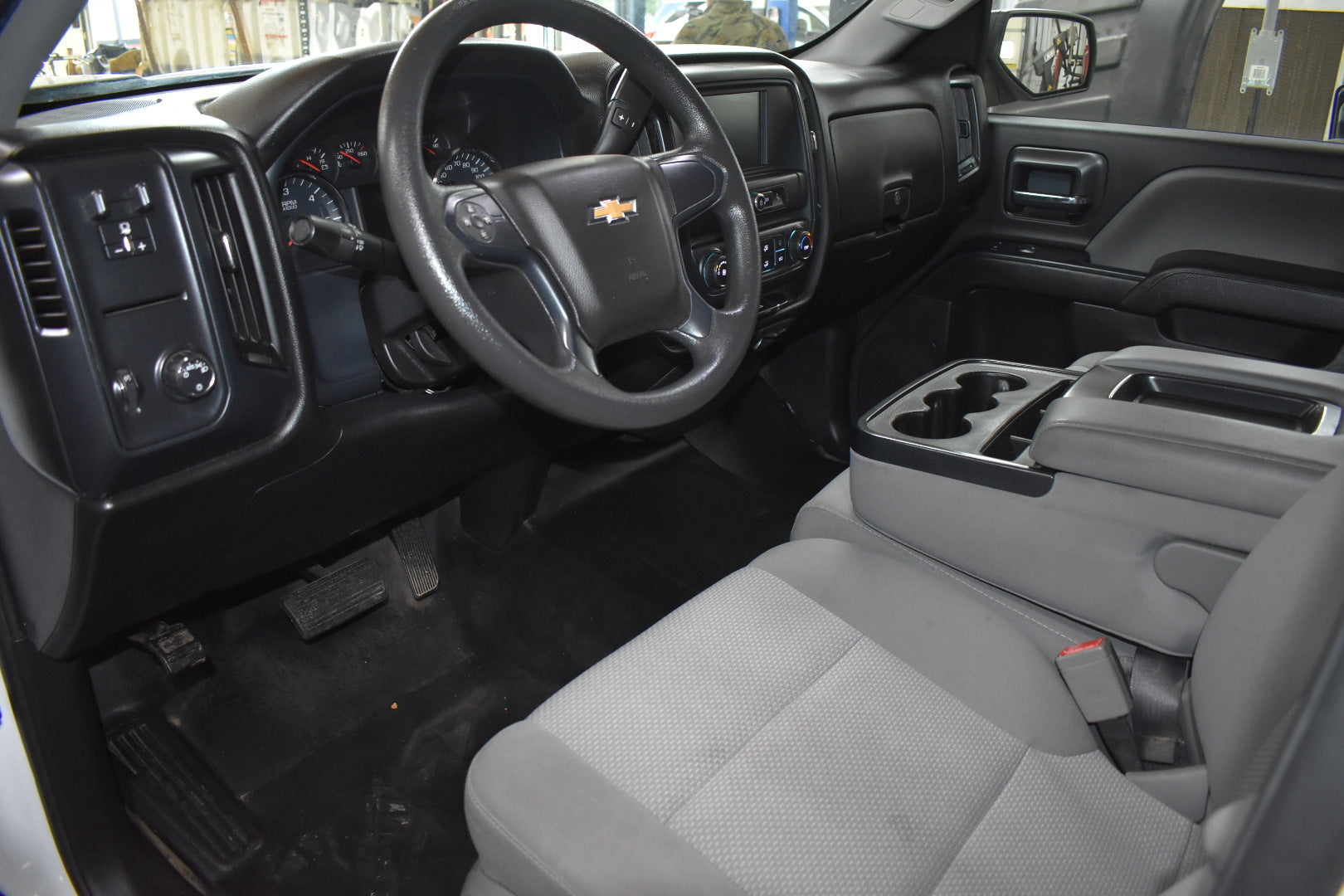 Chevrolet truck interior with steering wheel and dashboard