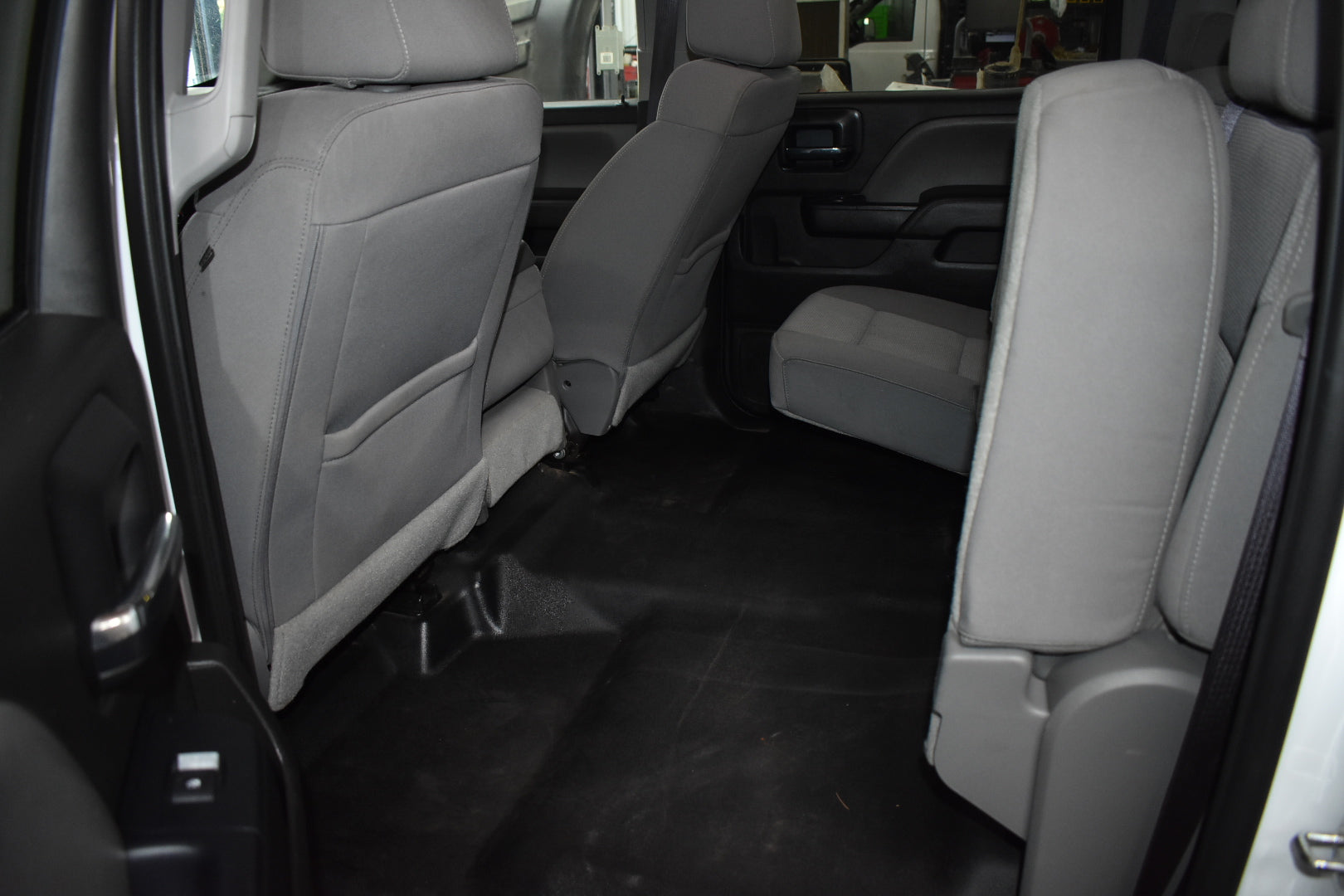 Gray car interior with folded rear seats