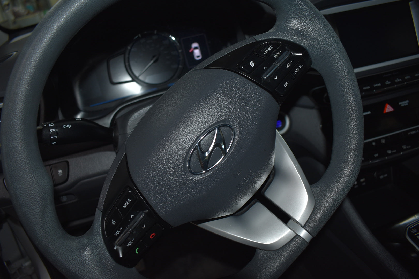 Steering wheel with Hyundai logo in a car interior