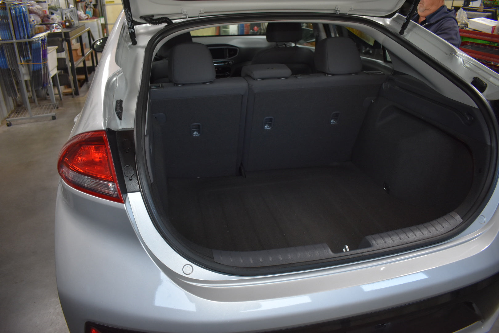 Open trunk of a car with visible interior and cargo space.