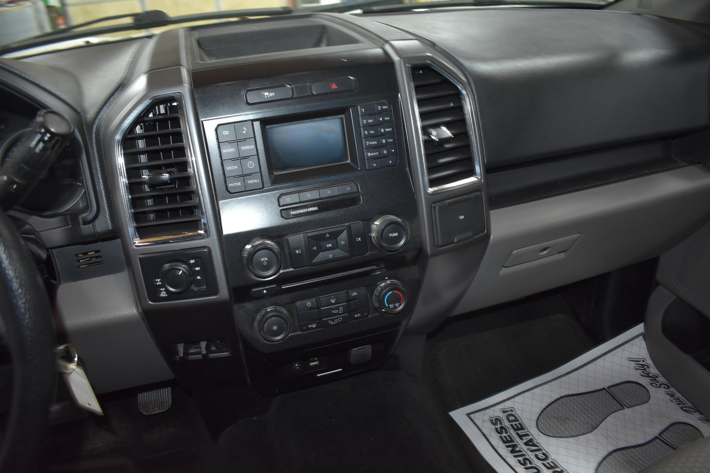 Car dashboard with central console and air vents