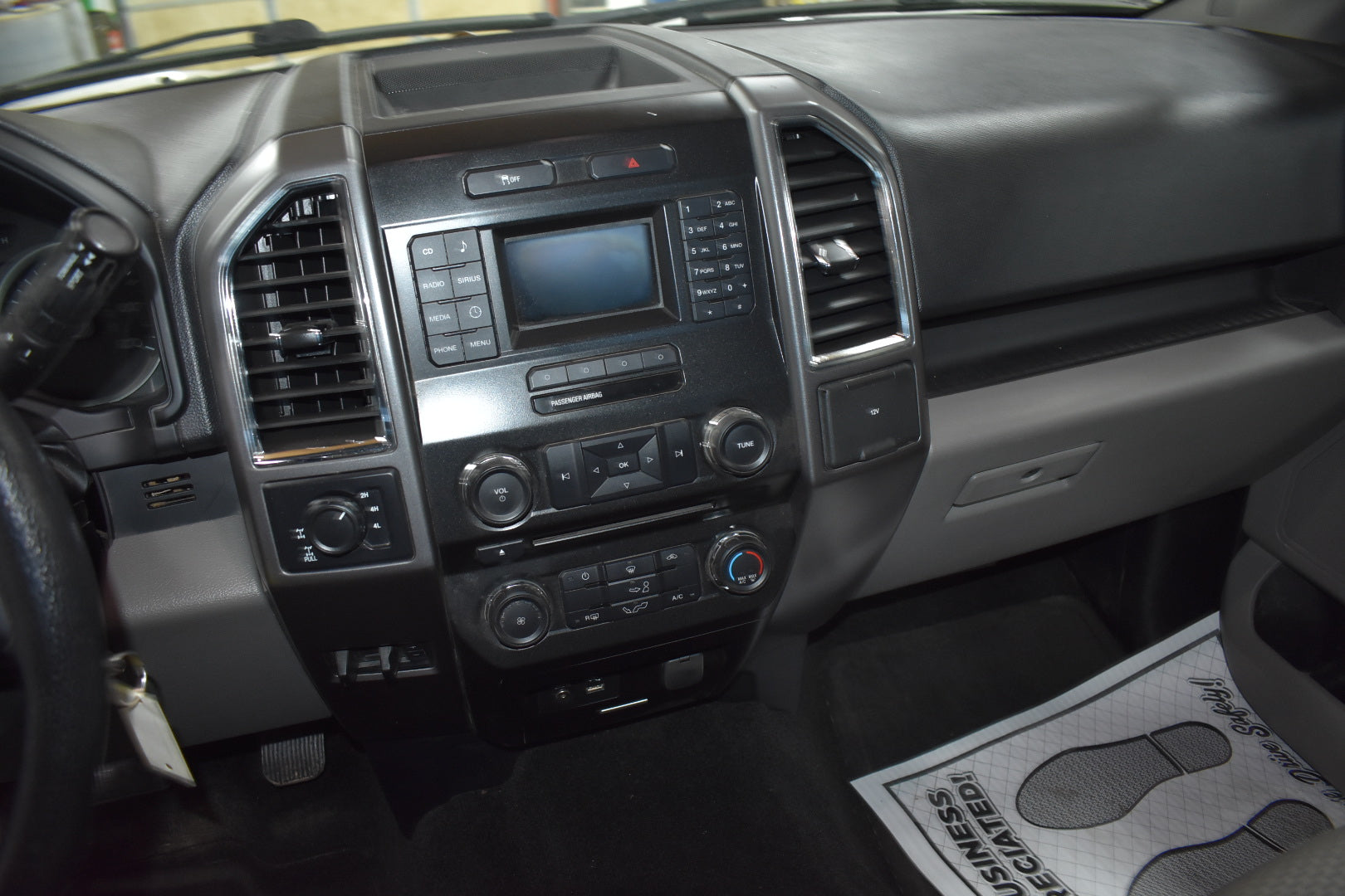 Car dashboard with central console and air vents