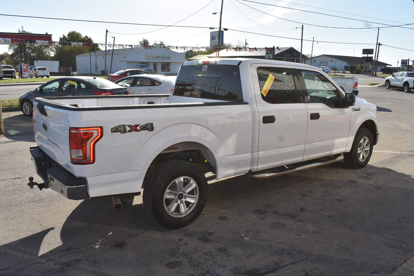 White pickup truck with '4x4' label on a street