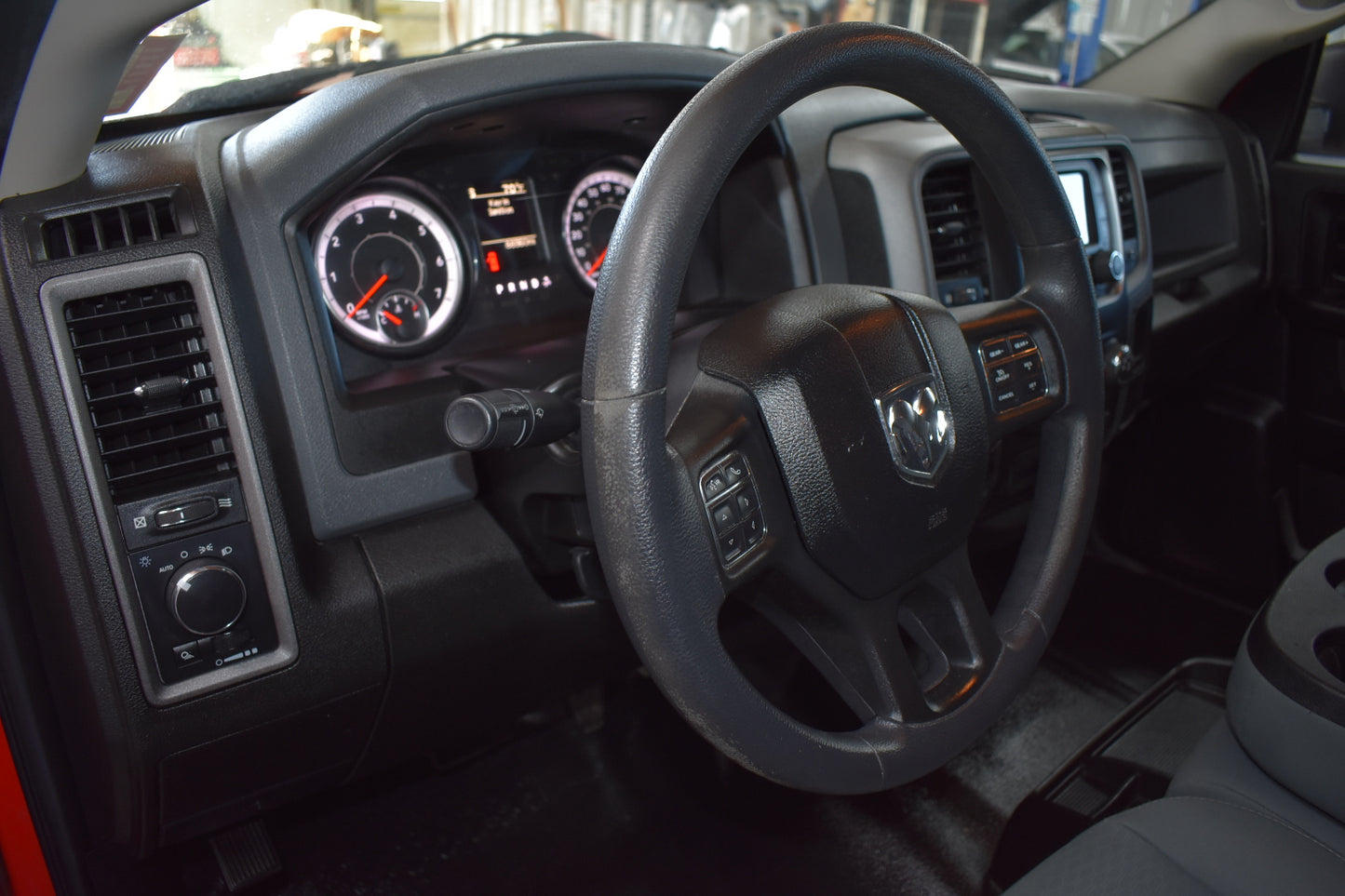 Car interior with steering wheel and dashboard