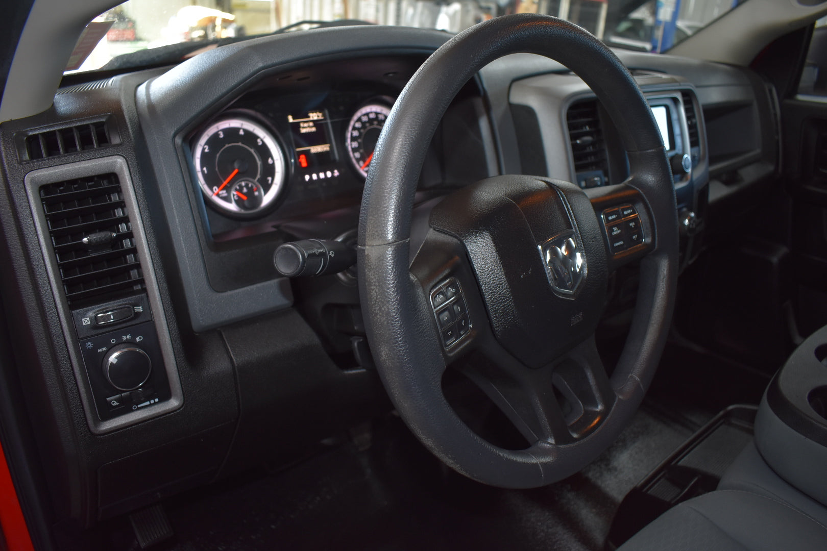 Car interior with steering wheel and dashboard