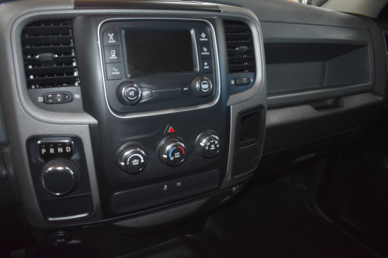 Car dashboard with control panel and air vents