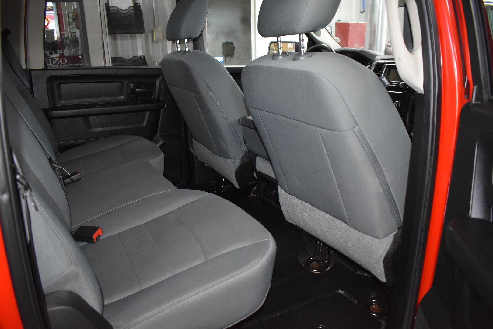 Gray car interior with open door showing seats