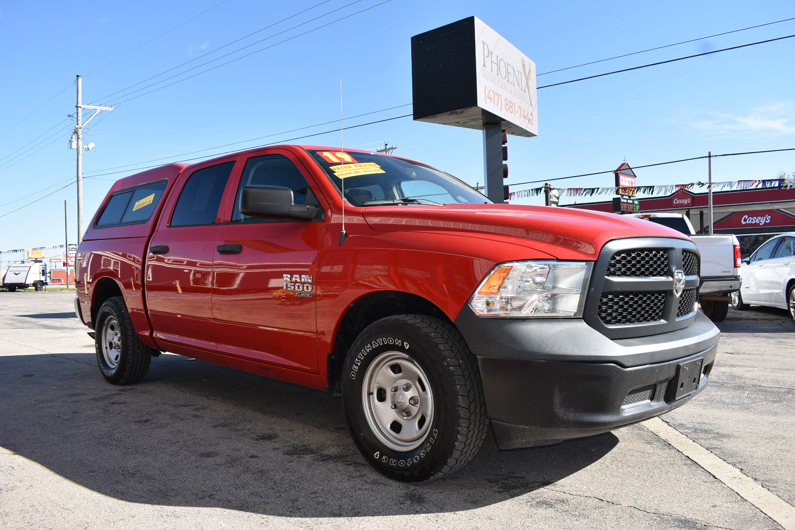 Red Ram truck parked in a lot with a clear sky