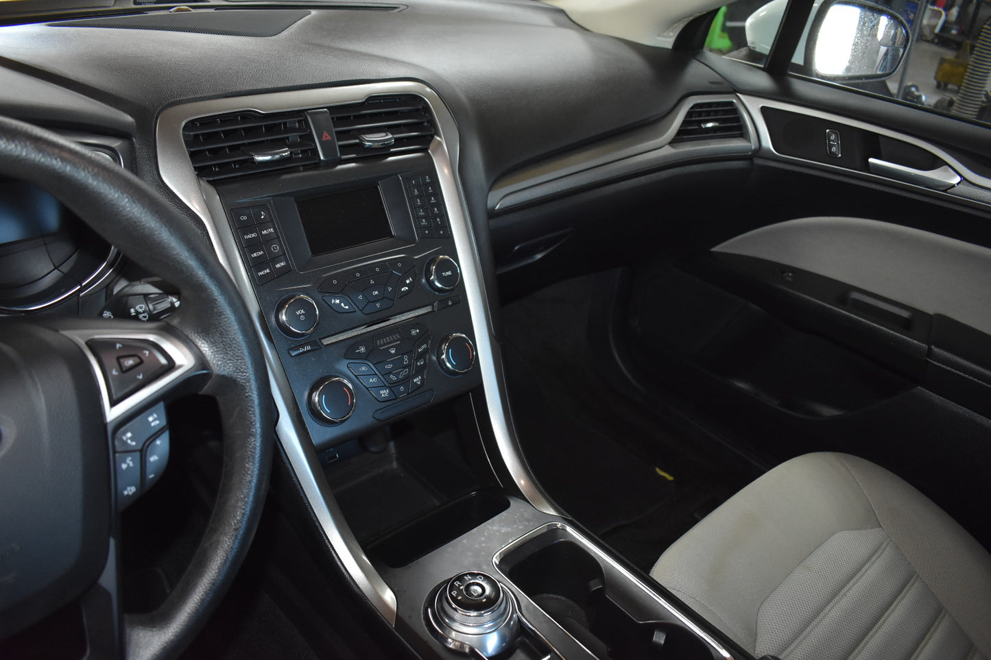 Car interior with dashboard and steering wheel
