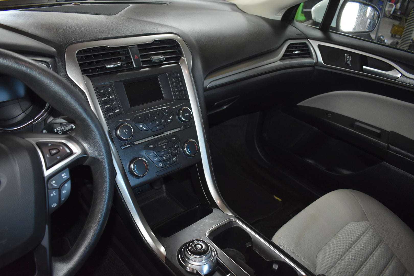 Car interior with dashboard and steering wheel