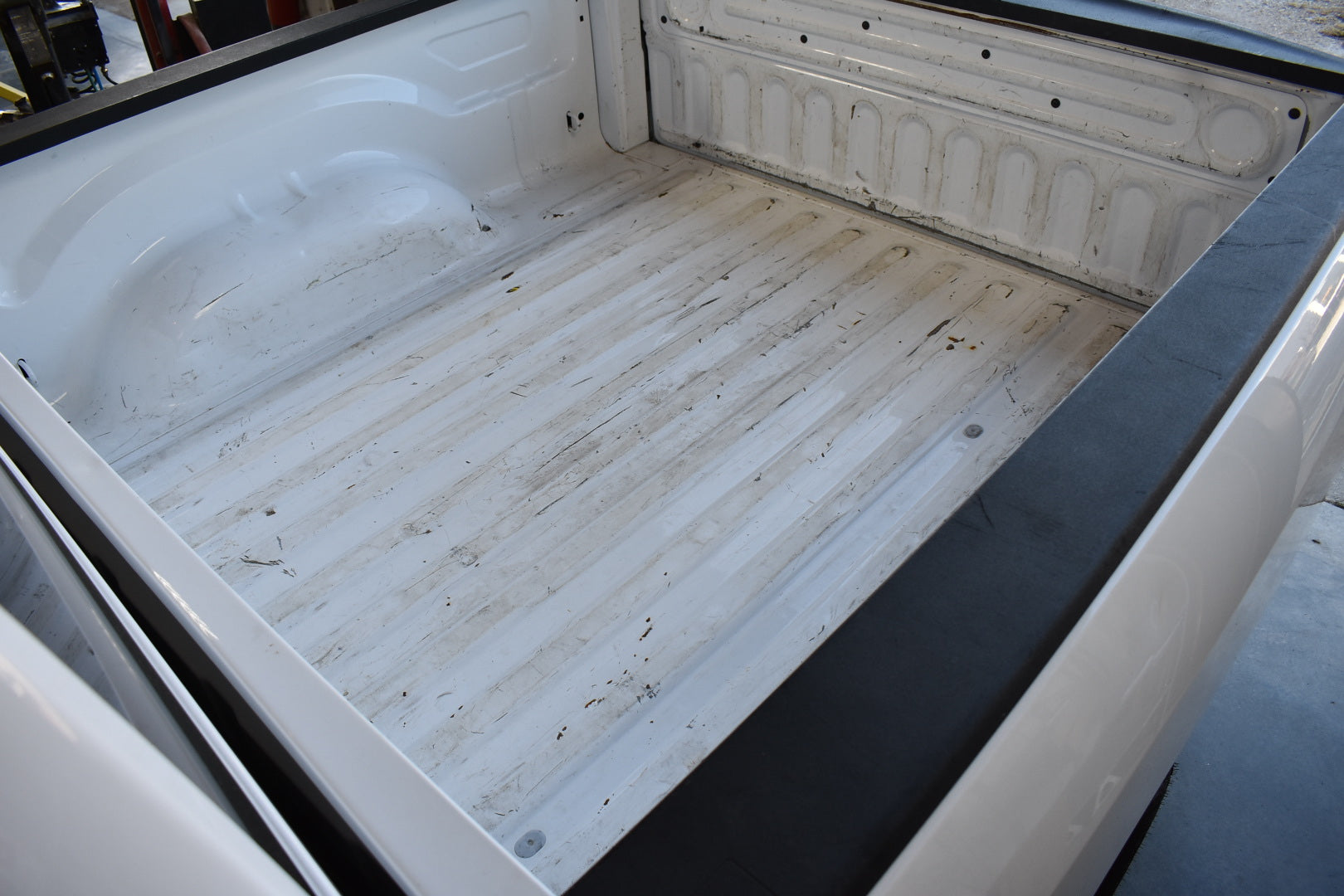 Empty truck bed with a white interior