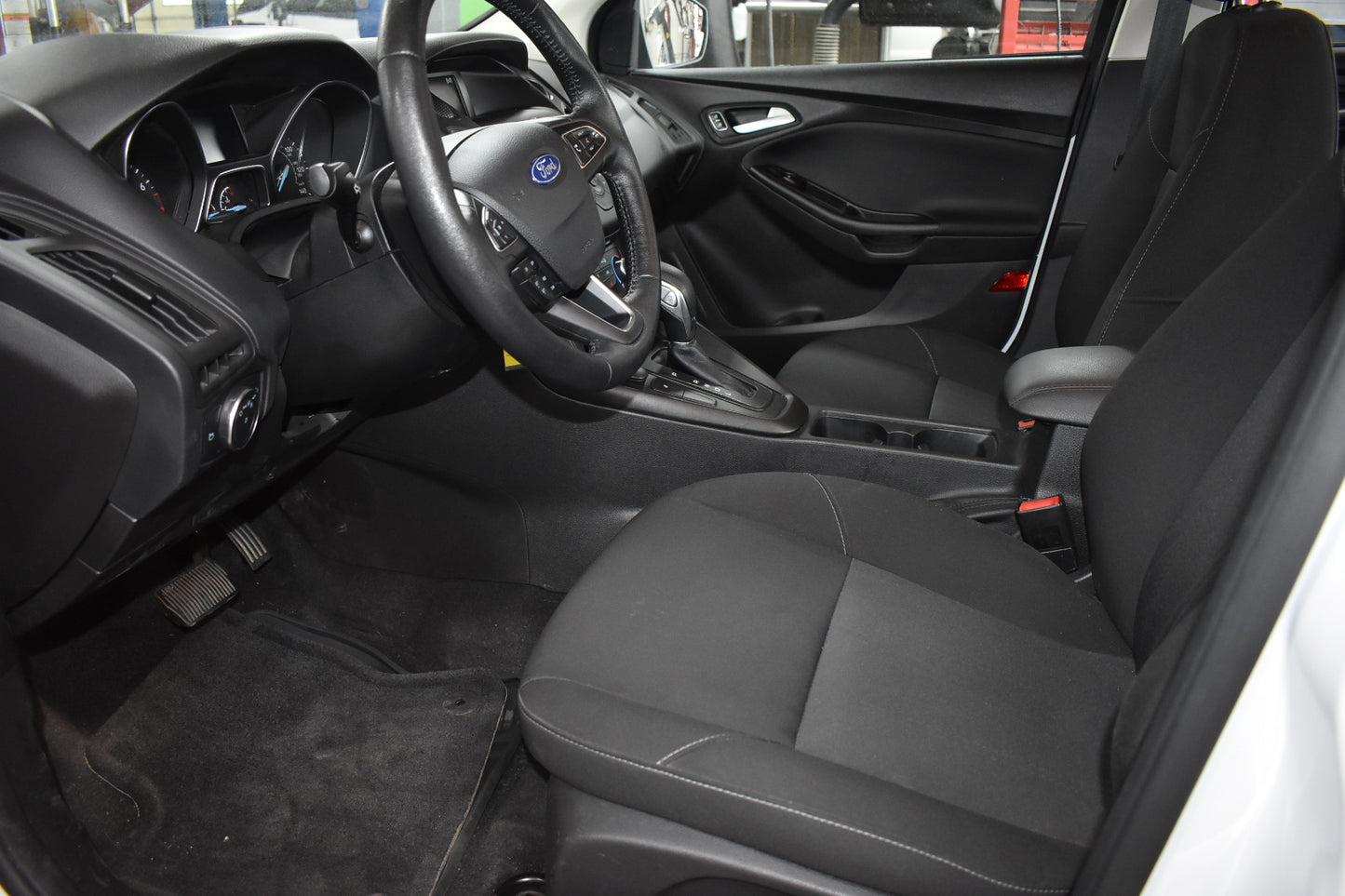 Car interior with steering wheel and dashboard