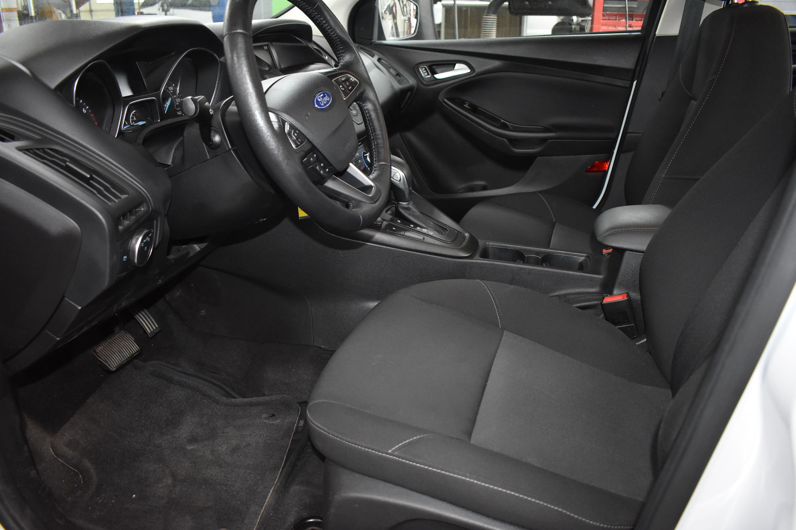 Car interior with steering wheel and dashboard