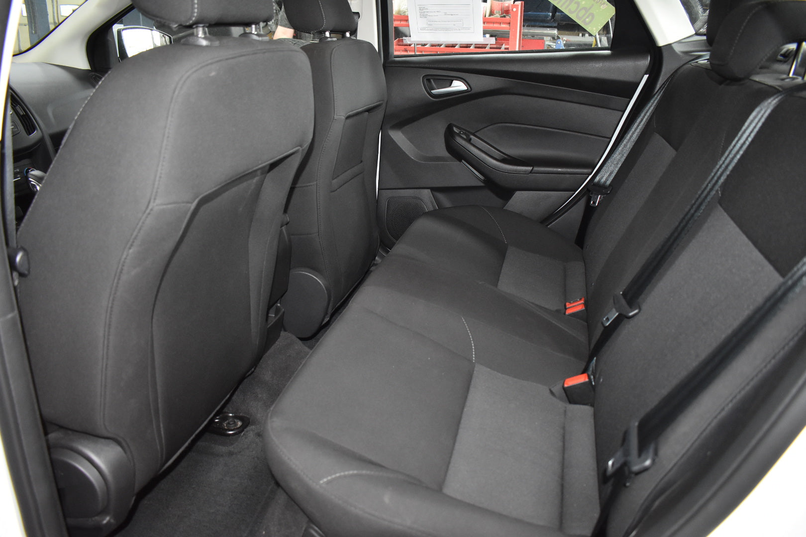 Back seat interior of a car with gray upholstery