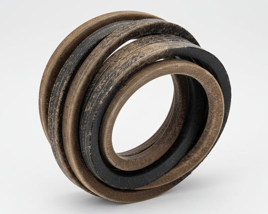 Set of V-belts stacked on a white background