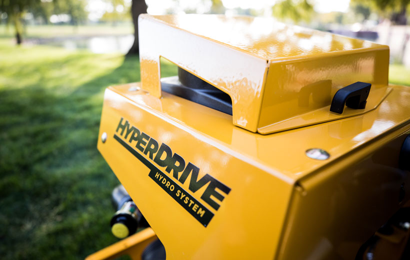 Yellow machine with 'Hyperdrive' branding on a grassy background