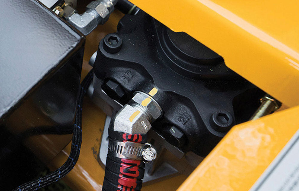 Close-up of a mechanical component on a yellow vehicle