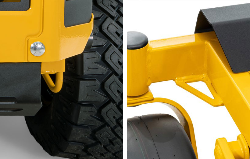 Close-up of a yellow vehicle tire and suspension system on a white background