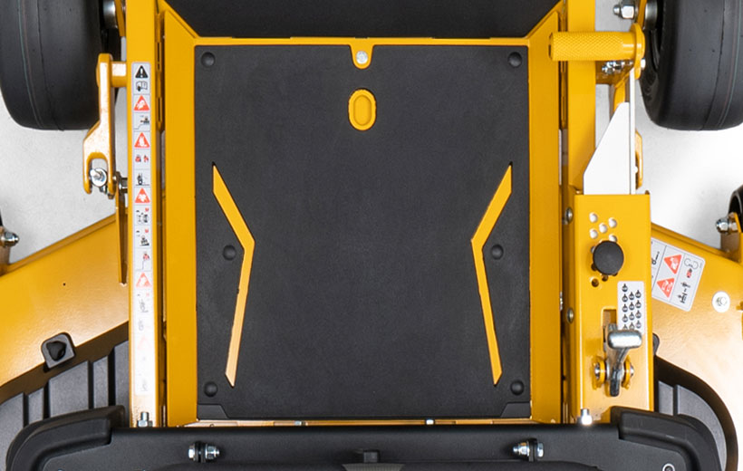 Close-up of a yellow and black piece of machinery, likely a lawn mower.