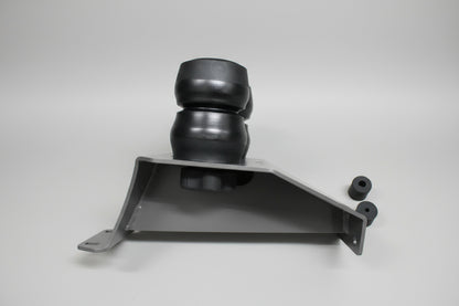 Metal bracket with spherical component on a gray tiled floor