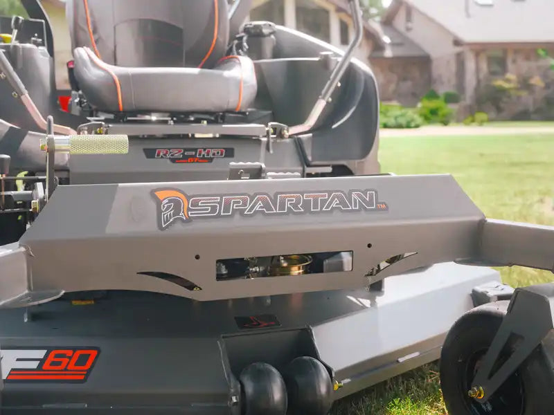 Close-up of a Spartan lawn mower with a grassy background
