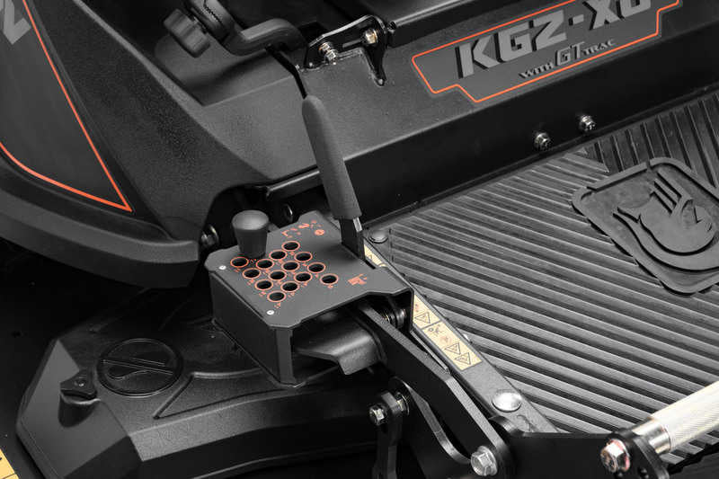 Close-up of a black machine with 'KG2-XG' branding on a textured surface.