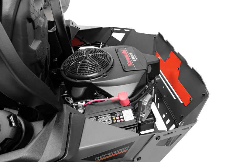 Close-up of a lawn mower engine with visible branding on a white background