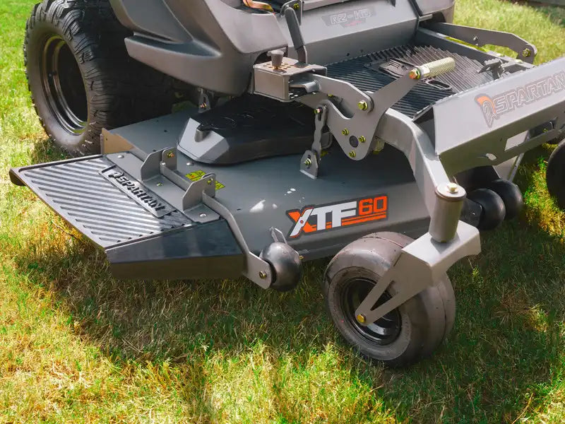 Lawn mower attachment on a grassy background