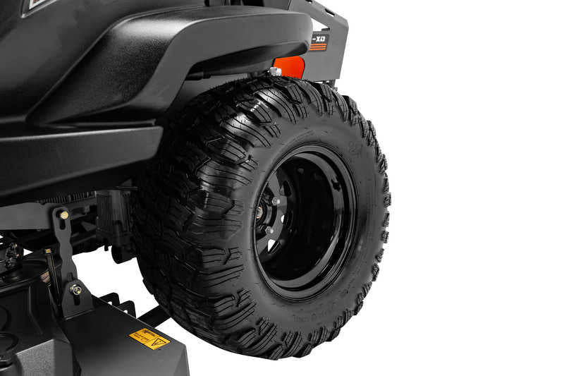 Close-up of a black off-road vehicle tire on a white background