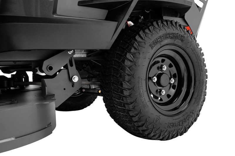 Close-up of a vehicle tire with off-road tread pattern on a white background