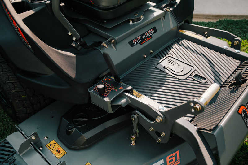 Close-up of a lawn mower with visible branding and components.