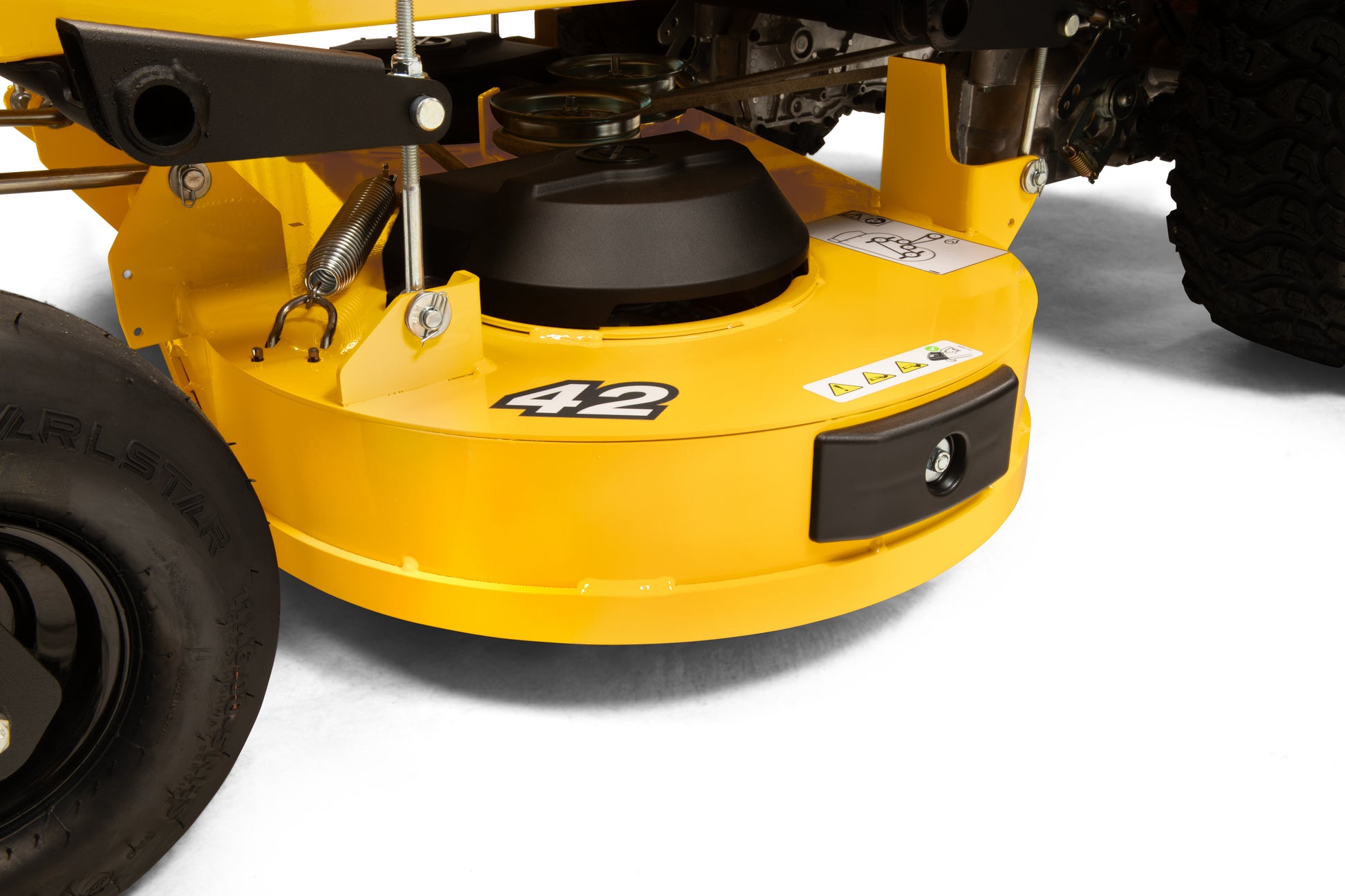 Close-up of a yellow lawn mower deck with '42' branding on a white background
