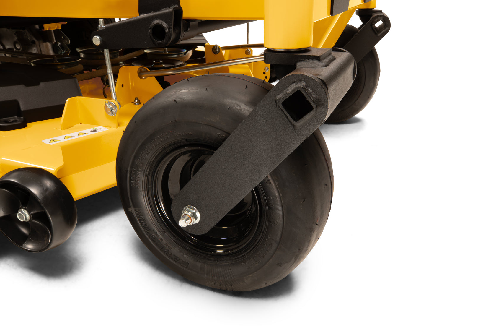 Close-up of a yellow lawn mower with black wheels on a white background
