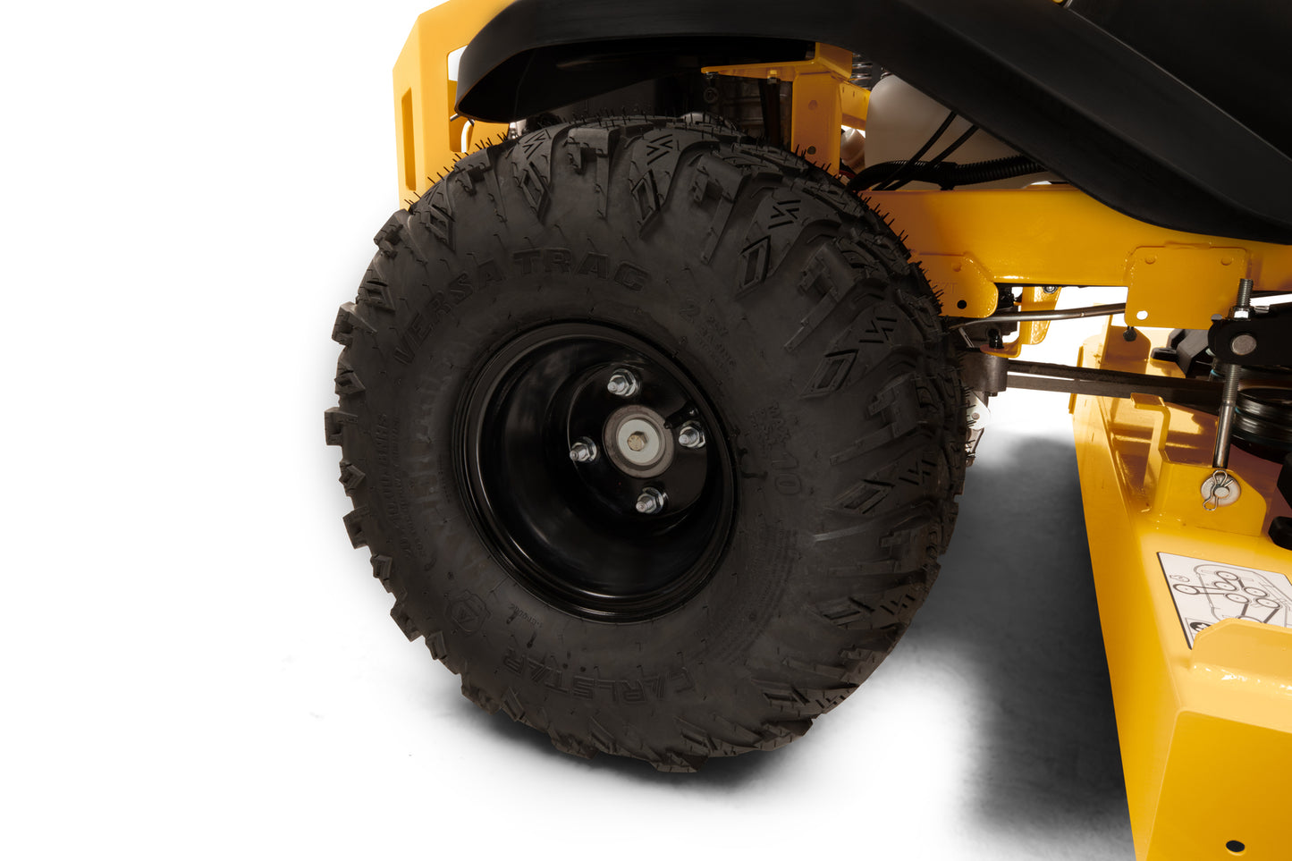 Close-up of a yellow lawn mower with a large black tire on a white background