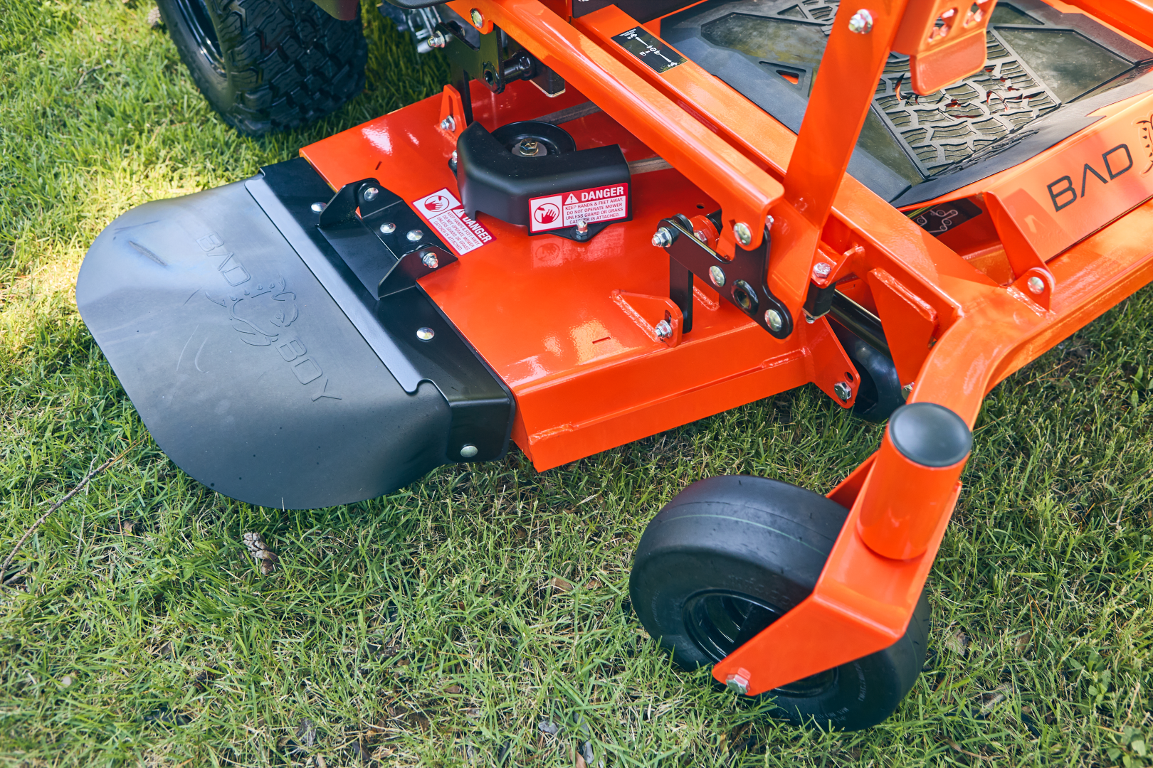 Close-up of a lawn mower deck on grass