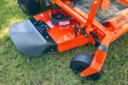 Close-up of a lawn mower deck on grass