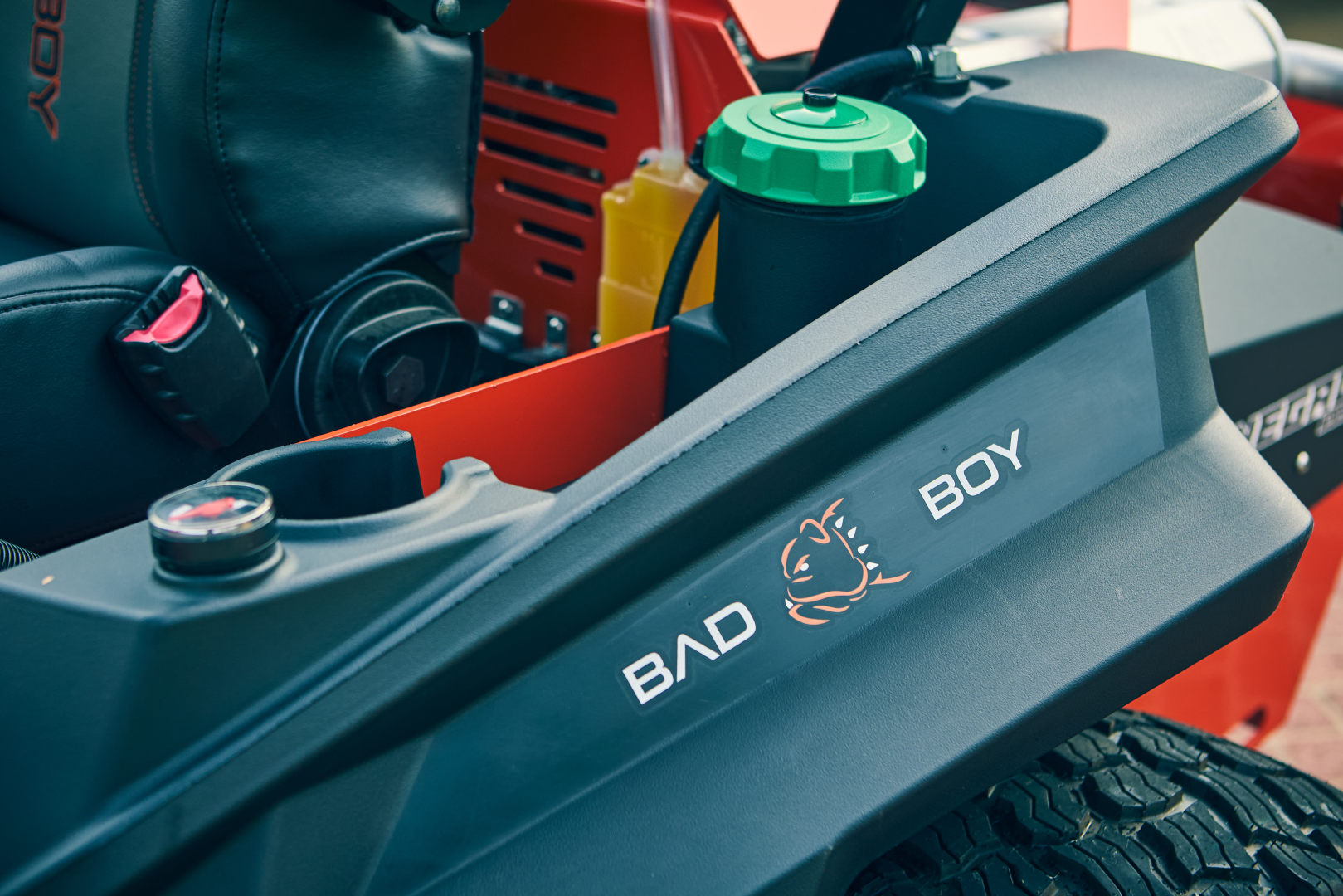 Close-up of a machine with 'BOY' and 'BAD' branding on a blurred background