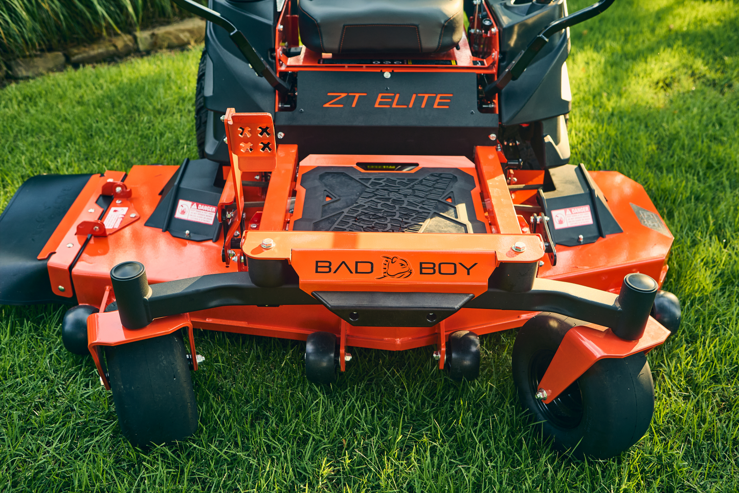 Orange Bad Boy ZT Elite lawn mower on grass