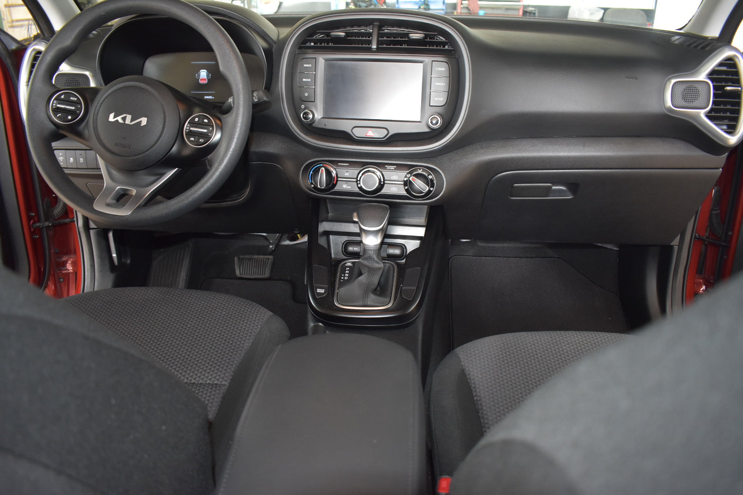 Car interior with steering wheel and dashboard view