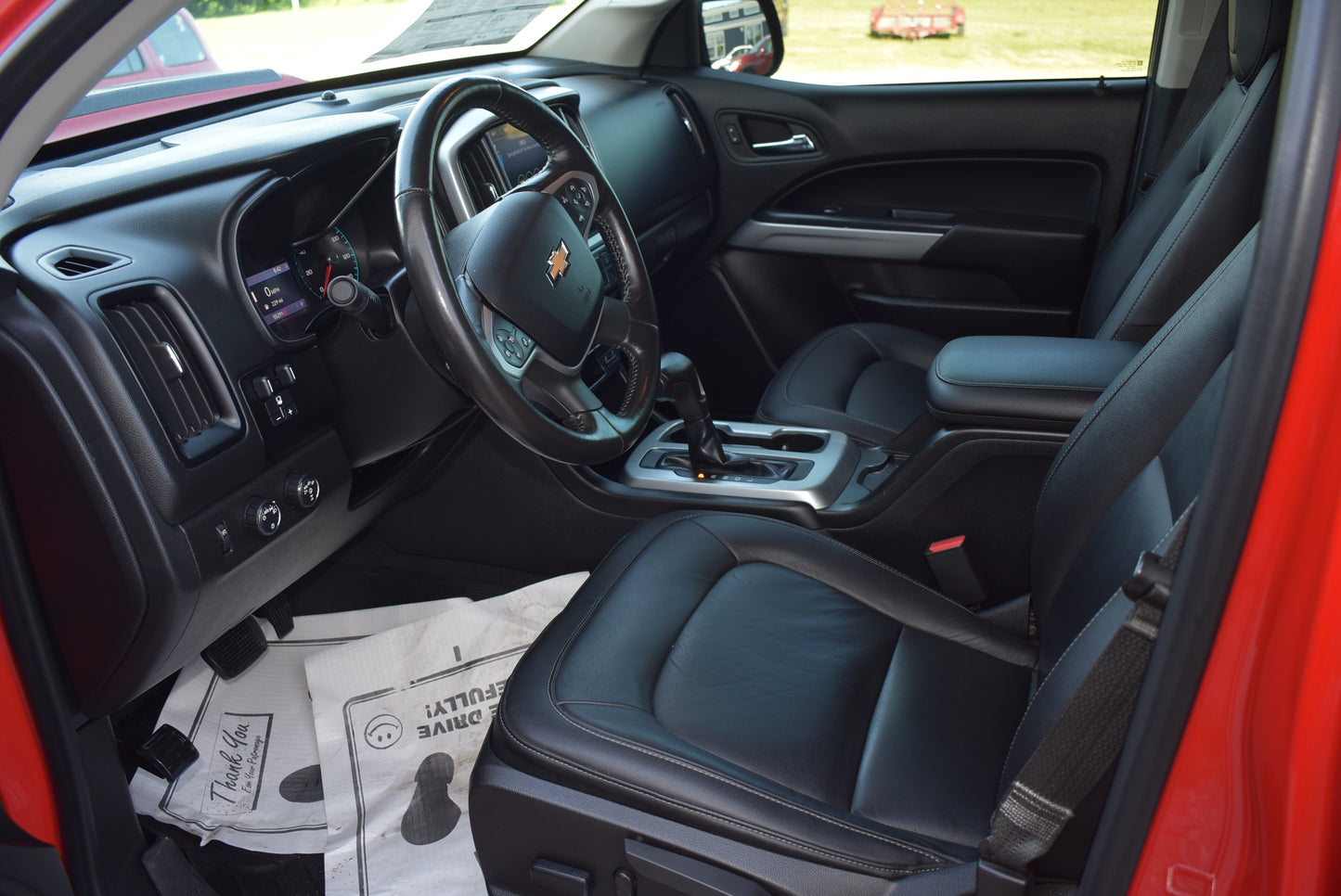 Car interior with steering wheel and dashboard view