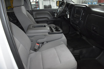 Interior of a vehicle with gray seats and dashboard.