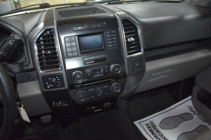 Car dashboard with central console and air vents