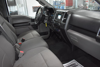 Car interior with gray seats and dashboard in a showroom setting