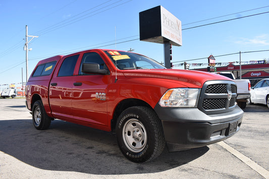 Red Ram truck parked in a lot with a clear sky