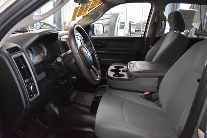 Car interior with steering wheel and dashboard in a showroom setting