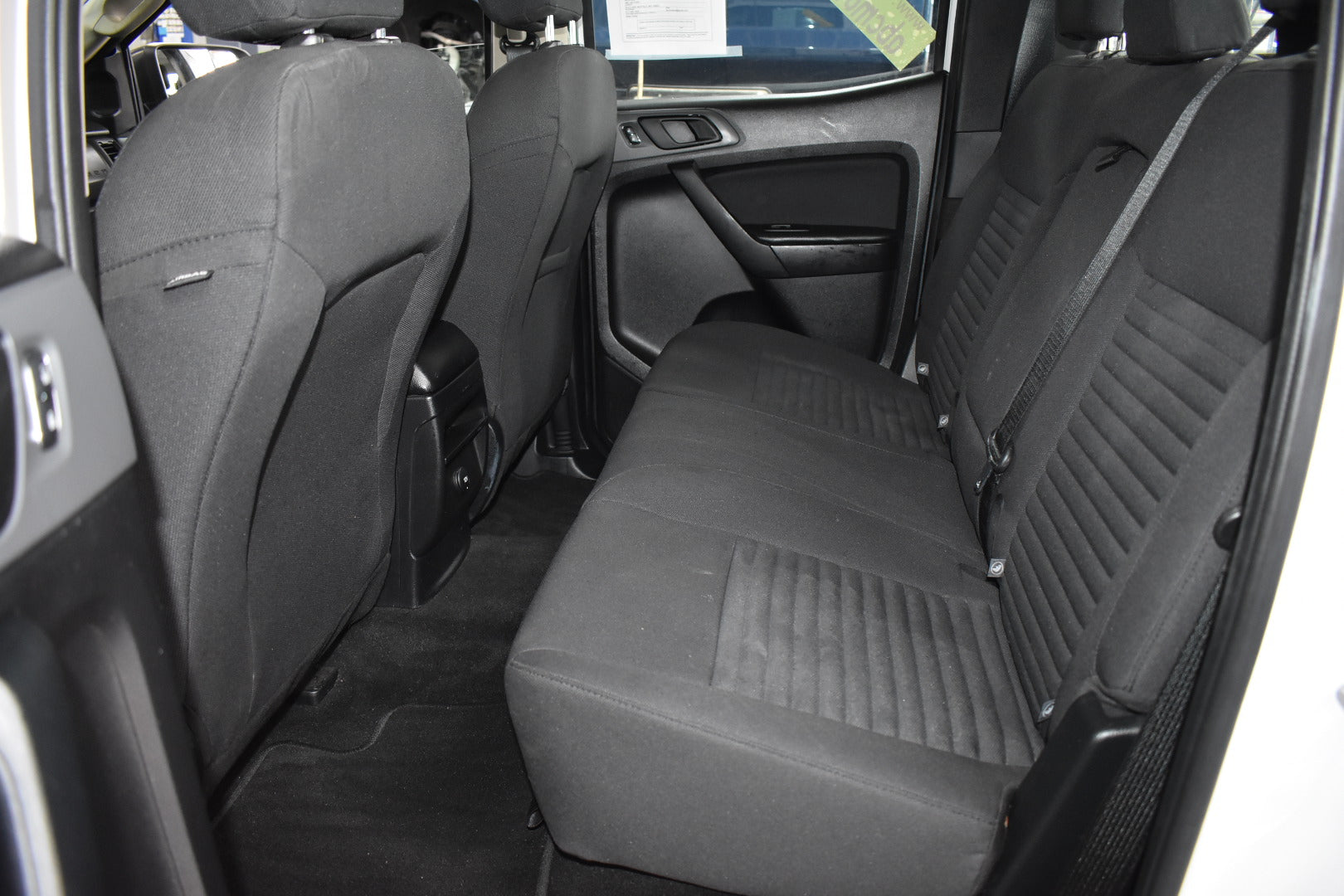 Back seat of a car with gray upholstery