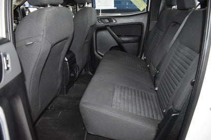 Back seat of a car with gray upholstery