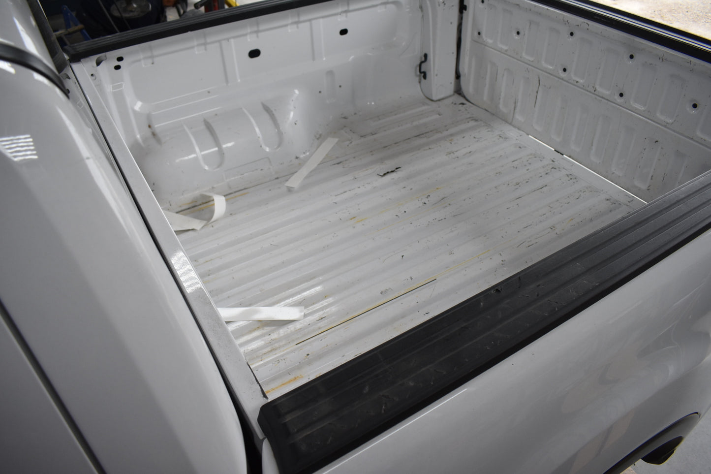 Empty truck bed with a white liner