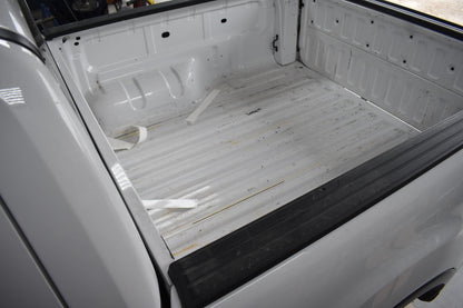 Empty truck bed with a white liner